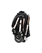 1102672630_2025_maxicosi_stroller_Eva3_essentialblackchampagne_onehandflashfold_side